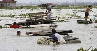 Typhoon destroys bridge, knocks out power in Philippines